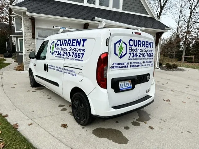 The Current Electrical Systems work van parked outside a customer's home
